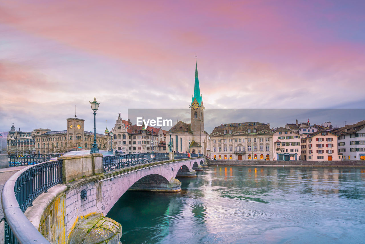 Cityscape of downtown zurich in switzerland during dramatic sunset.