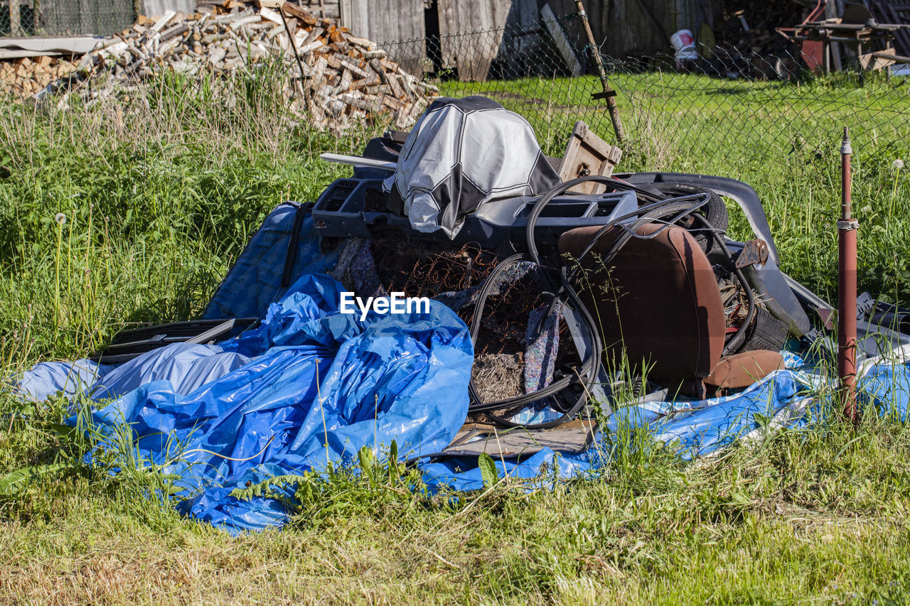 HIGH ANGLE VIEW OF GARBAGE BIN ON LAND