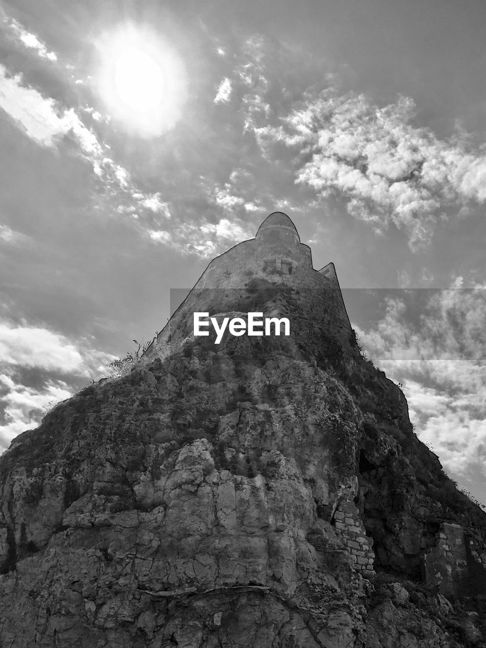 LOW ANGLE VIEW OF ROCKY MOUNTAIN AGAINST SKY