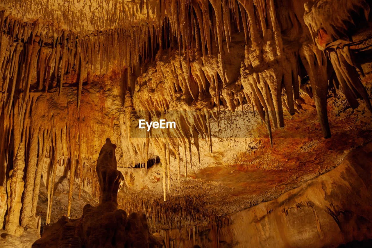 stalagmite, rock, cave, geology, rock formation, stalactite, speleothem, physical geography, nature, beauty in nature, caving, discovery, travel destinations, indoors, no people, non-urban scene, pattern, low angle view, illuminated