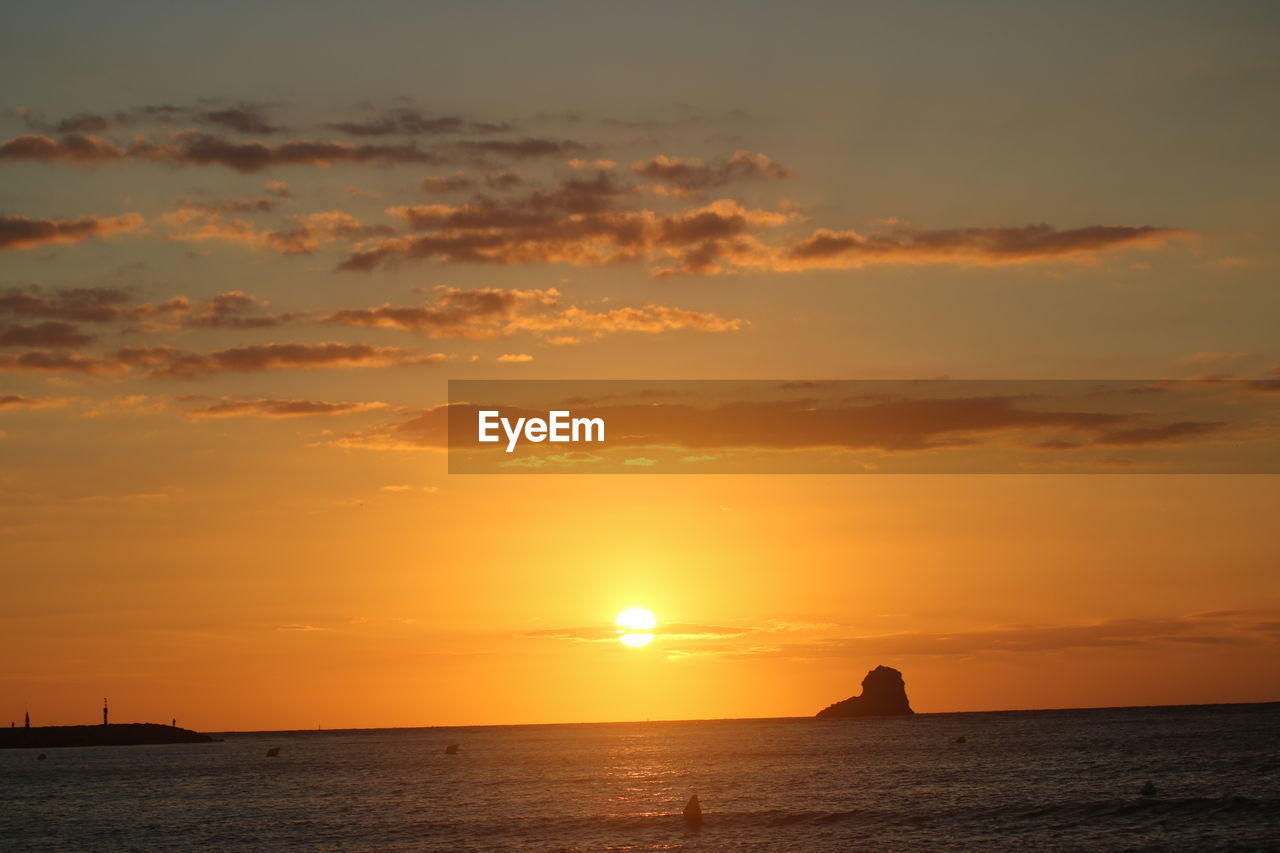 SCENIC VIEW OF SEA AGAINST ROMANTIC SKY