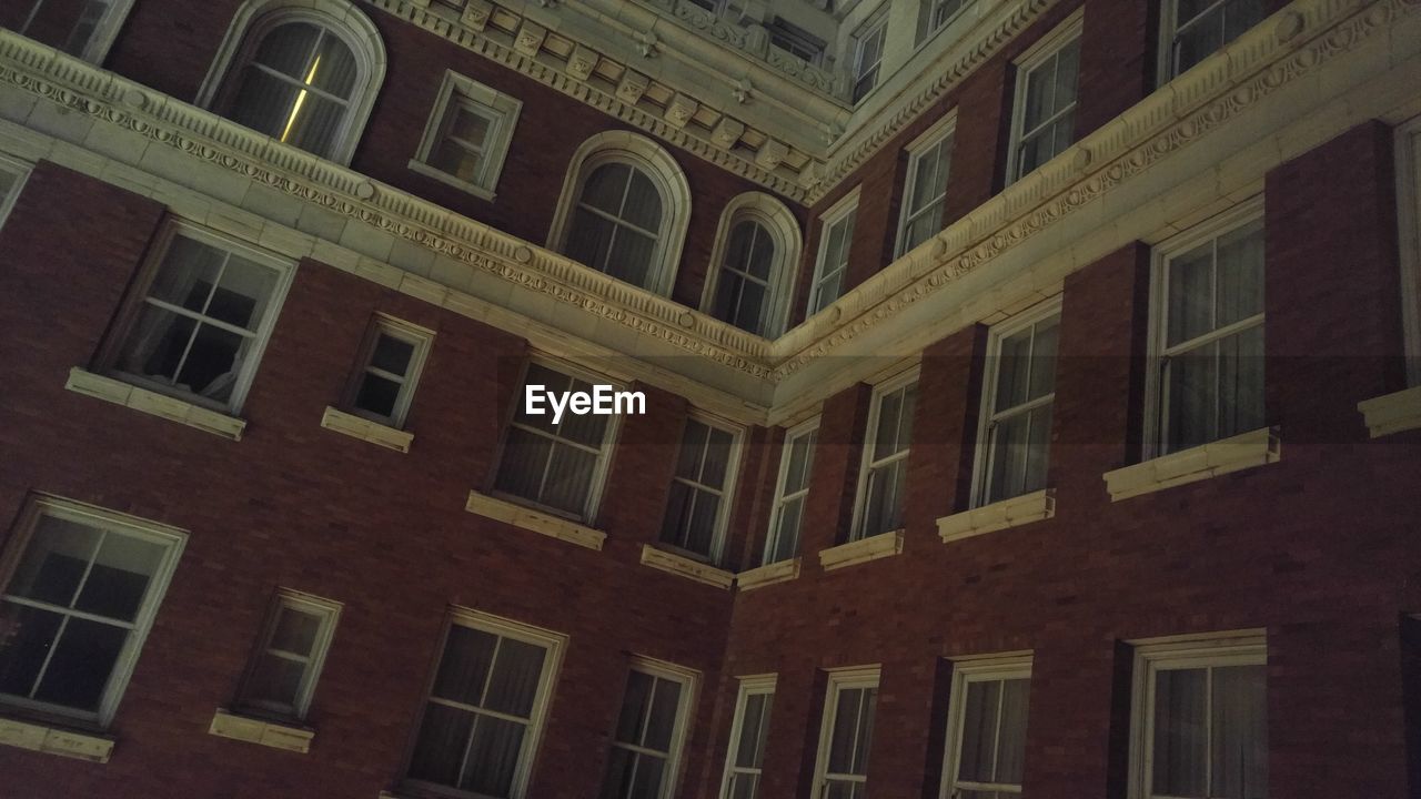 LOW ANGLE VIEW OF BUILDING WITH WINDOWS