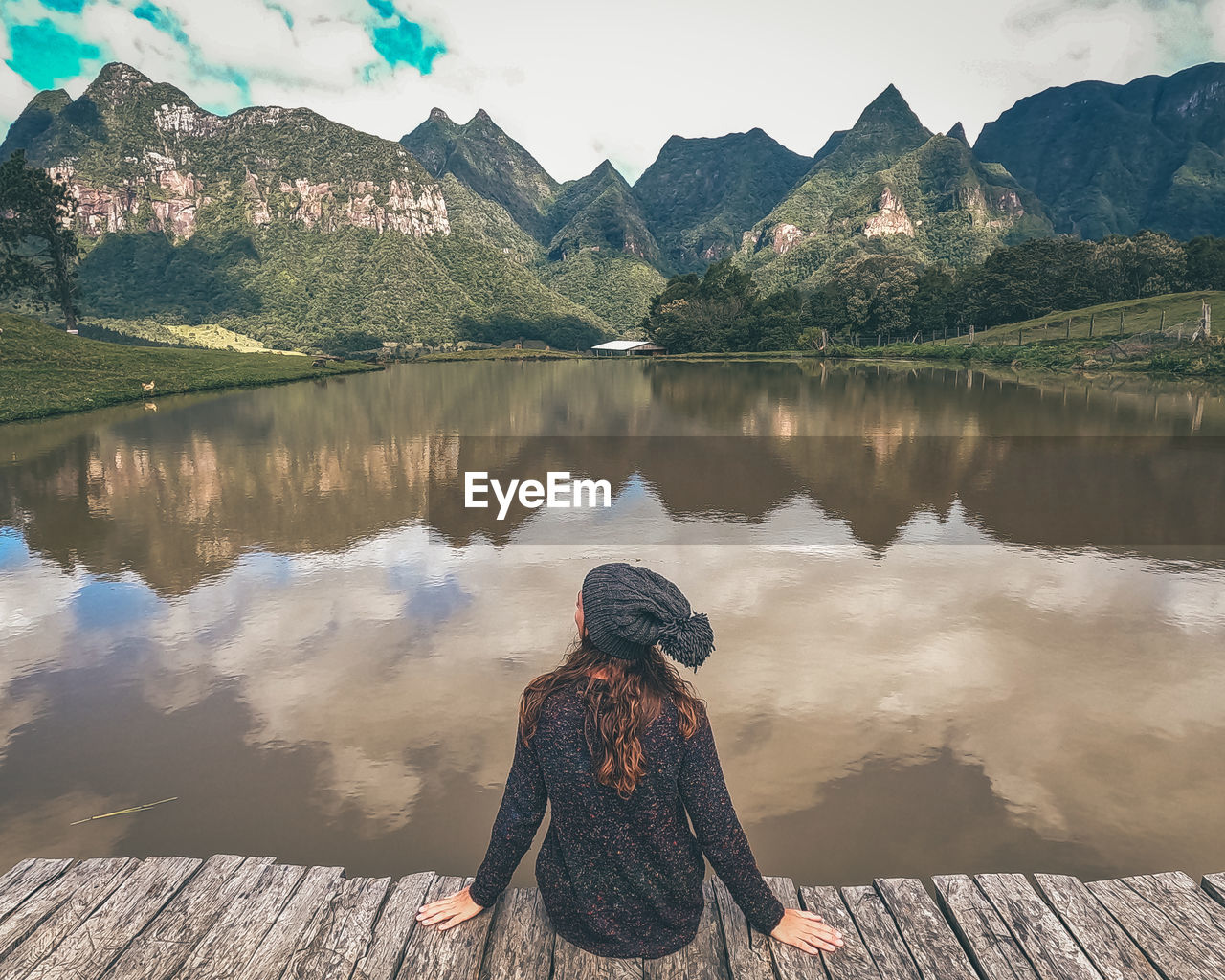Rear view of woman looking at lake