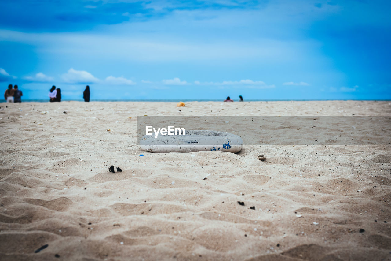 GROUP OF PEOPLE ON BEACH