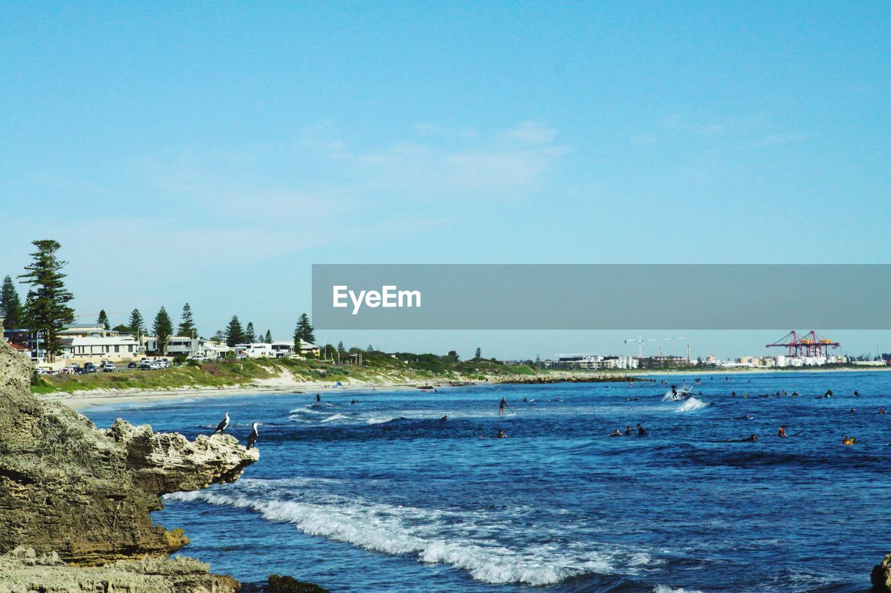 Scenic view of sea against clear blue sky