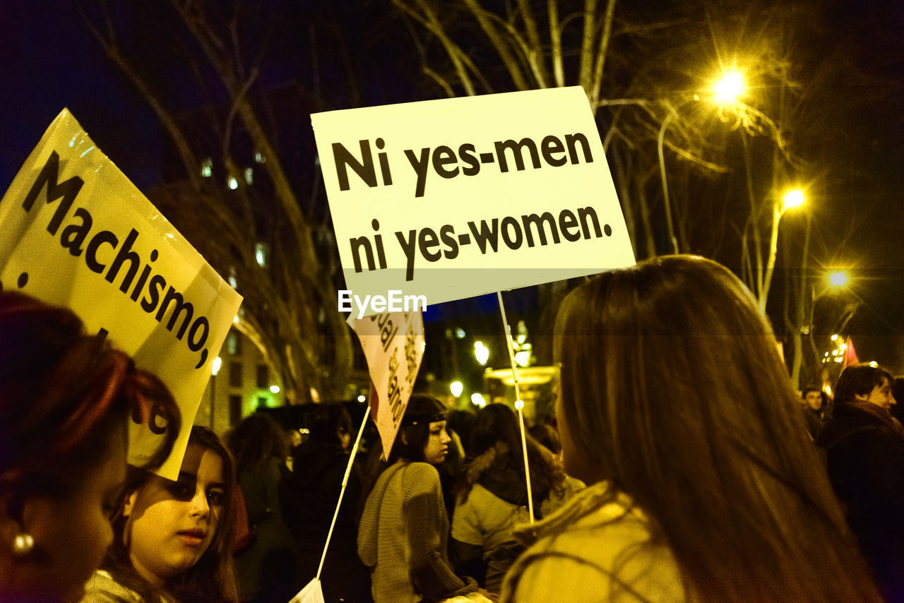 Protestors with banners at night