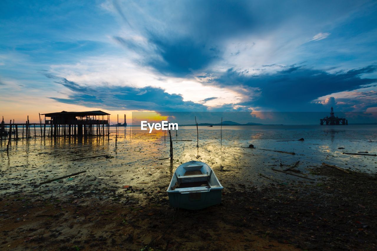 Scenic view of beach against sky during sunset