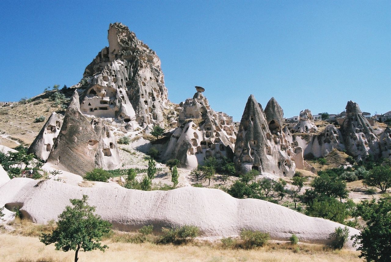 PANORAMIC VIEW OF ROCK FORMATION AGAINST CLEAR SKY