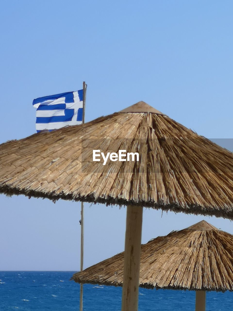 GAZEBO ON BEACH AGAINST CLEAR SKY