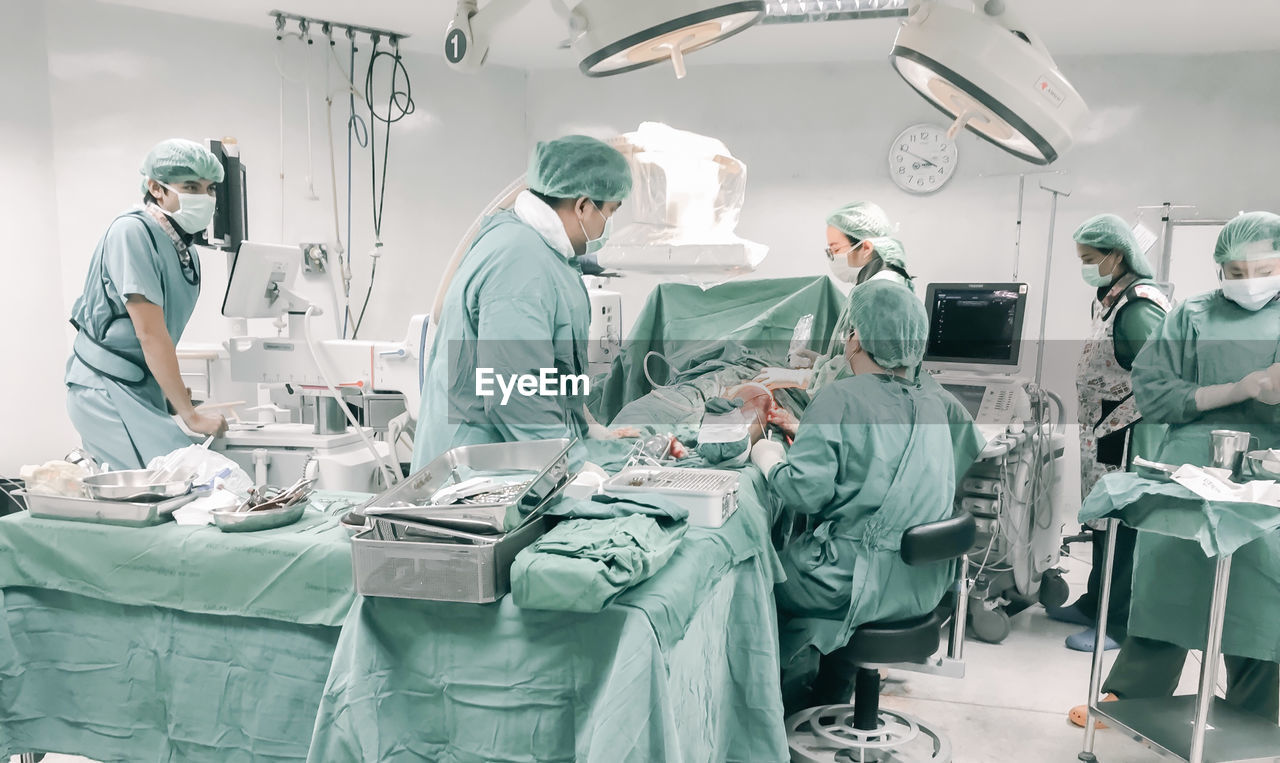 Doctors working in operating room at hospital