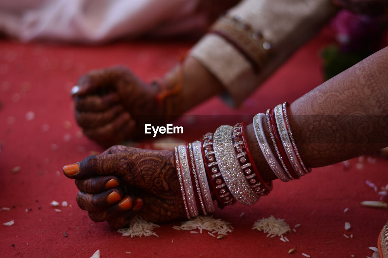 Cropped image of bride and broom hands during wedding