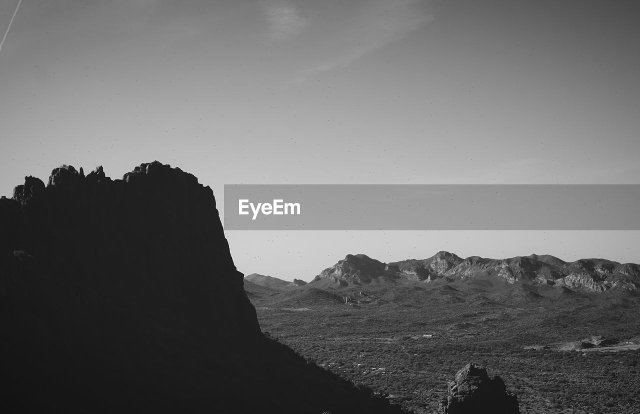 SCENIC VIEW OF ROCKS AGAINST CLEAR SKY