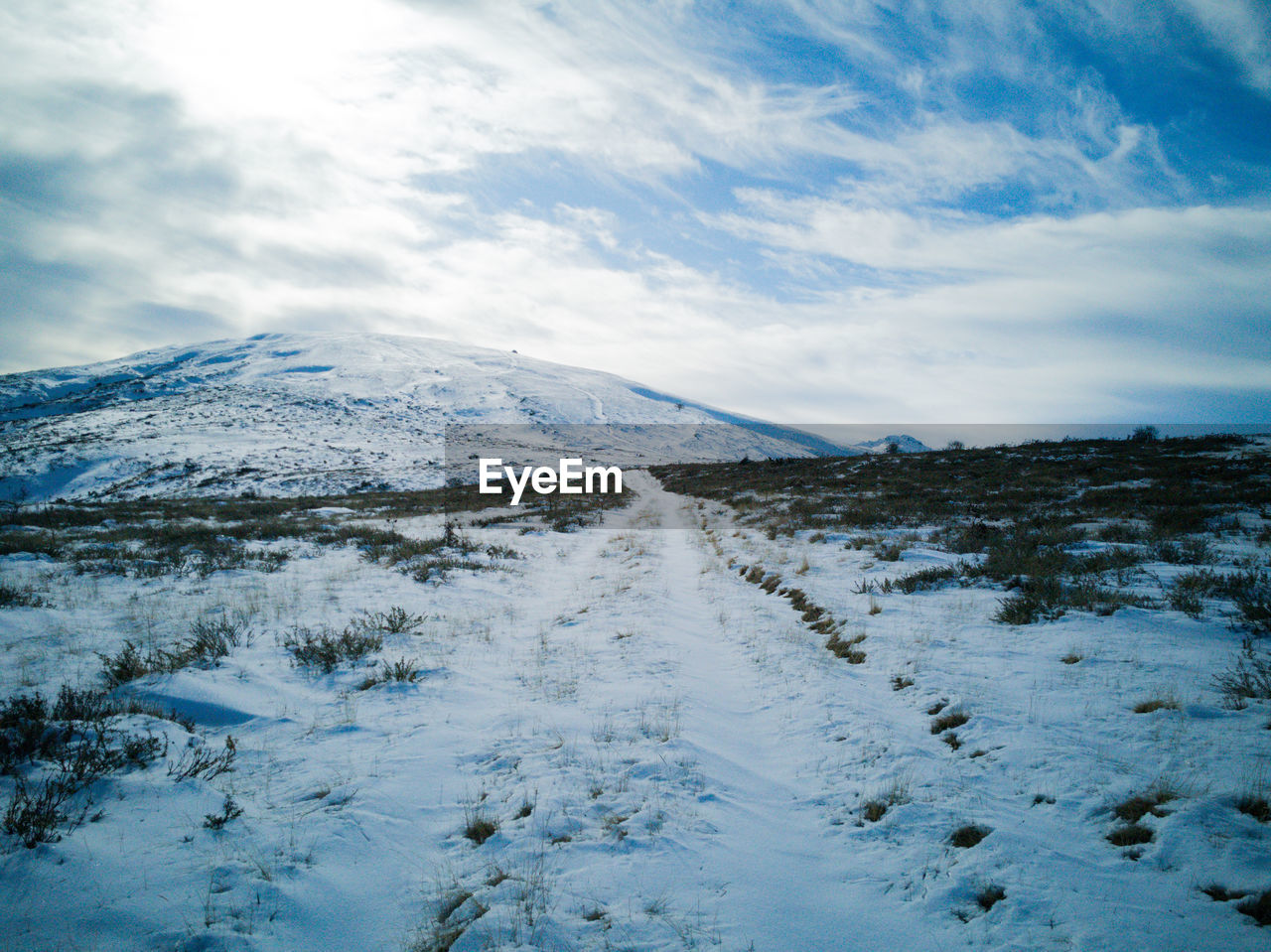 Snow covered mountain against sky