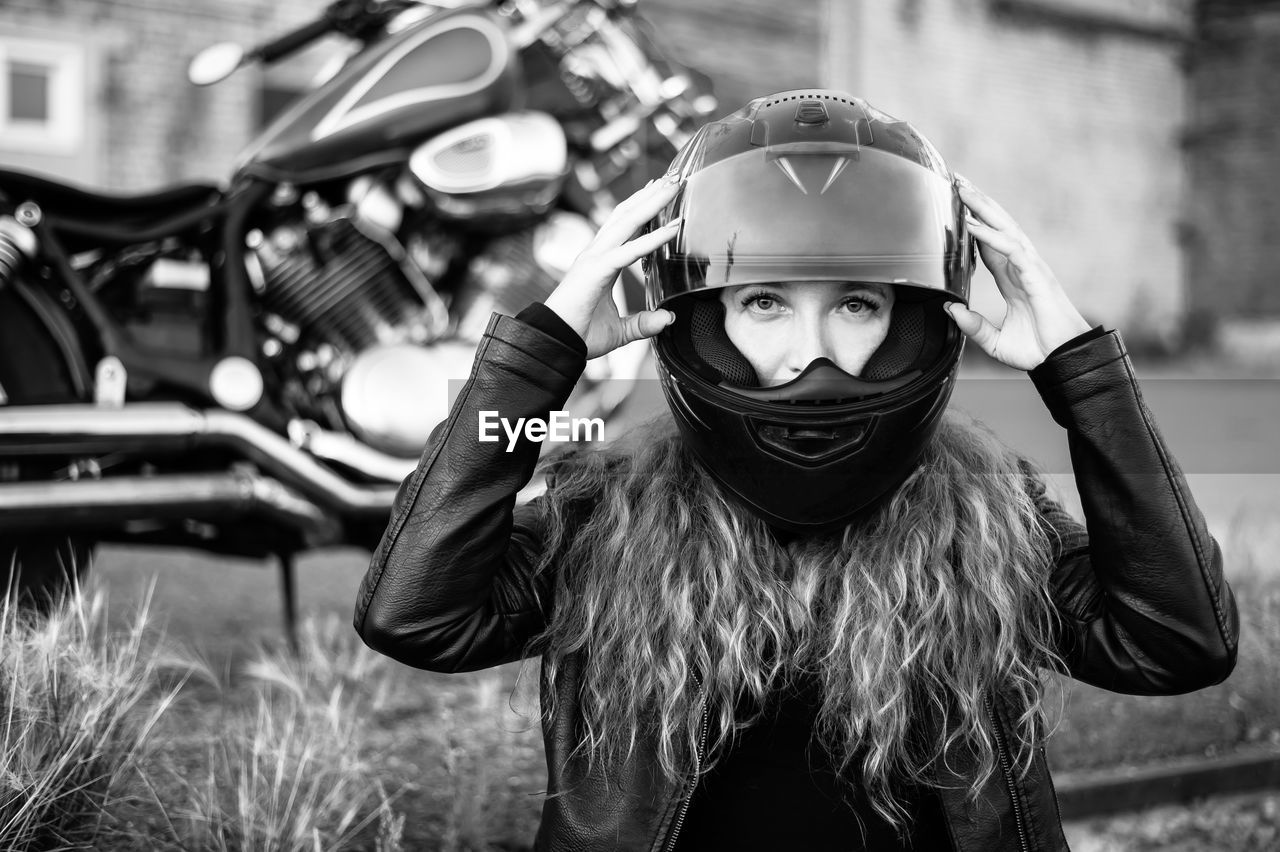 Portrait of girl wearing mask on field