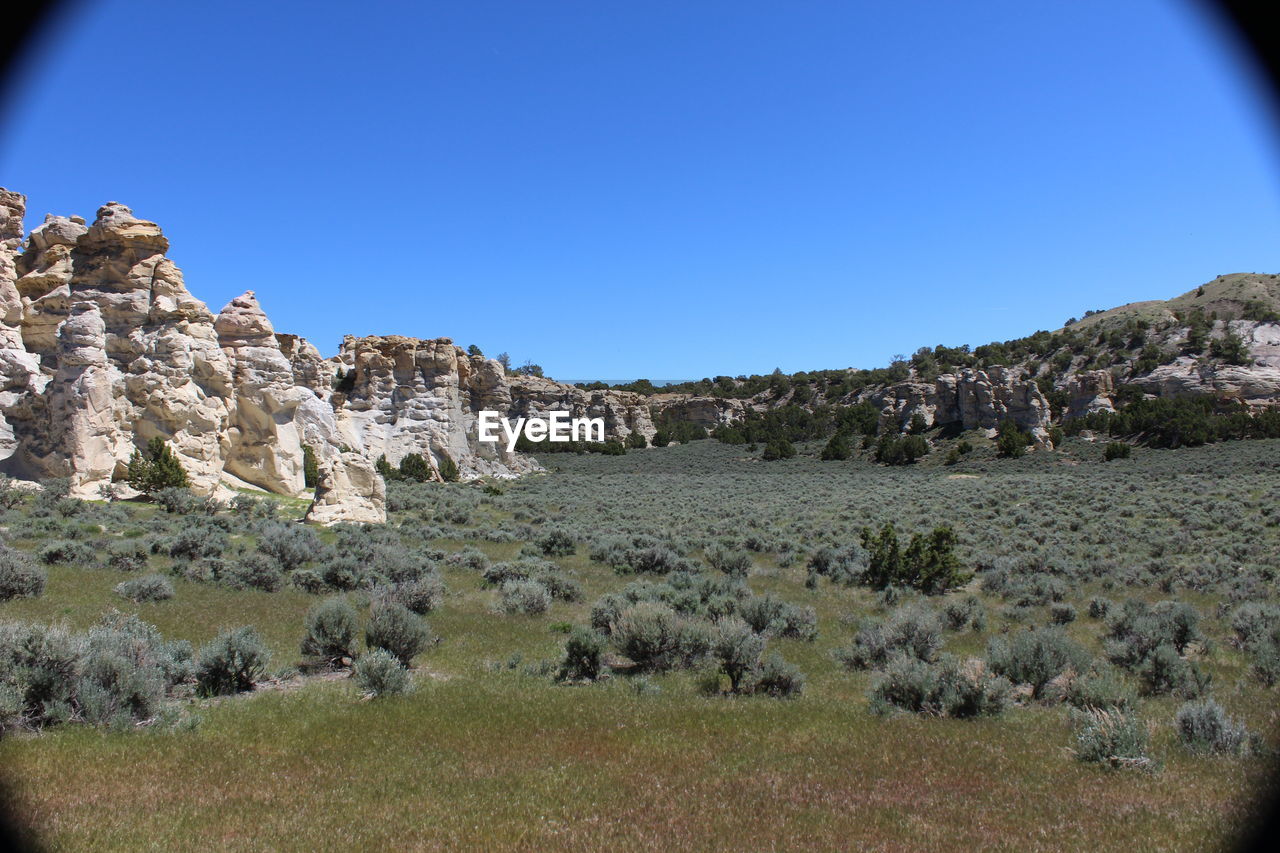 SCENIC VIEW OF MOUNTAINS AGAINST CLEAR BLUE SKY