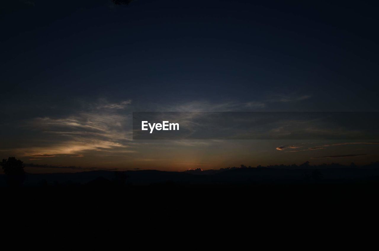 SILHOUETTE LANDSCAPE AGAINST SKY AT SUNSET