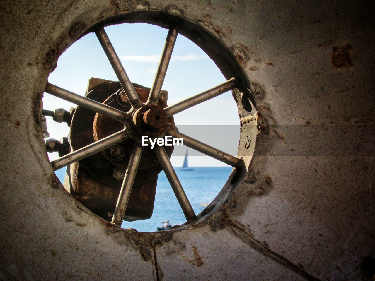 View of sea through old window