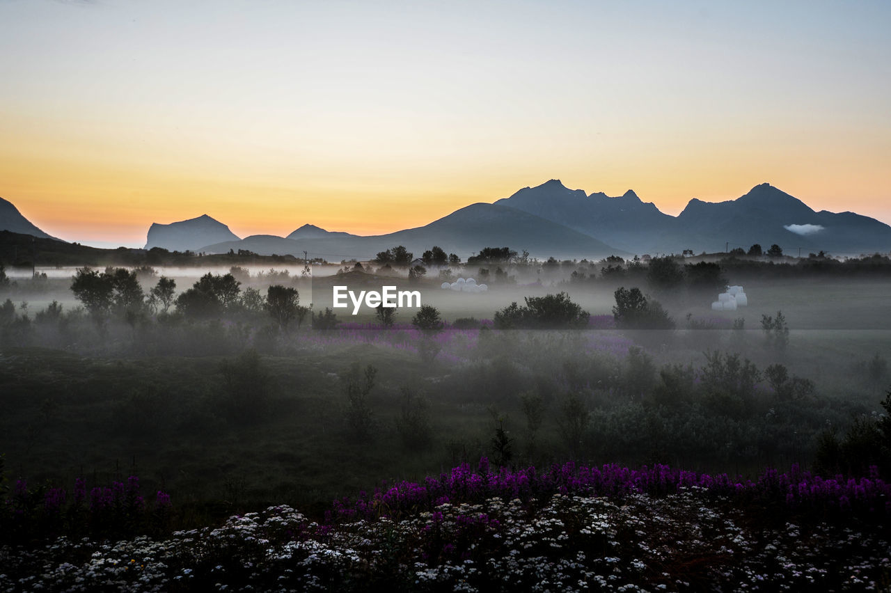 Scenic view of mountains against sky during sunset