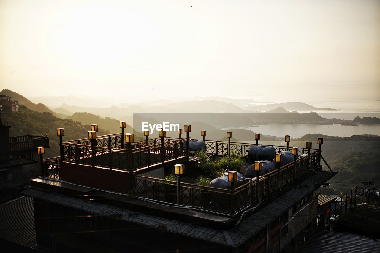 High angle view of buildings against sky during sunset