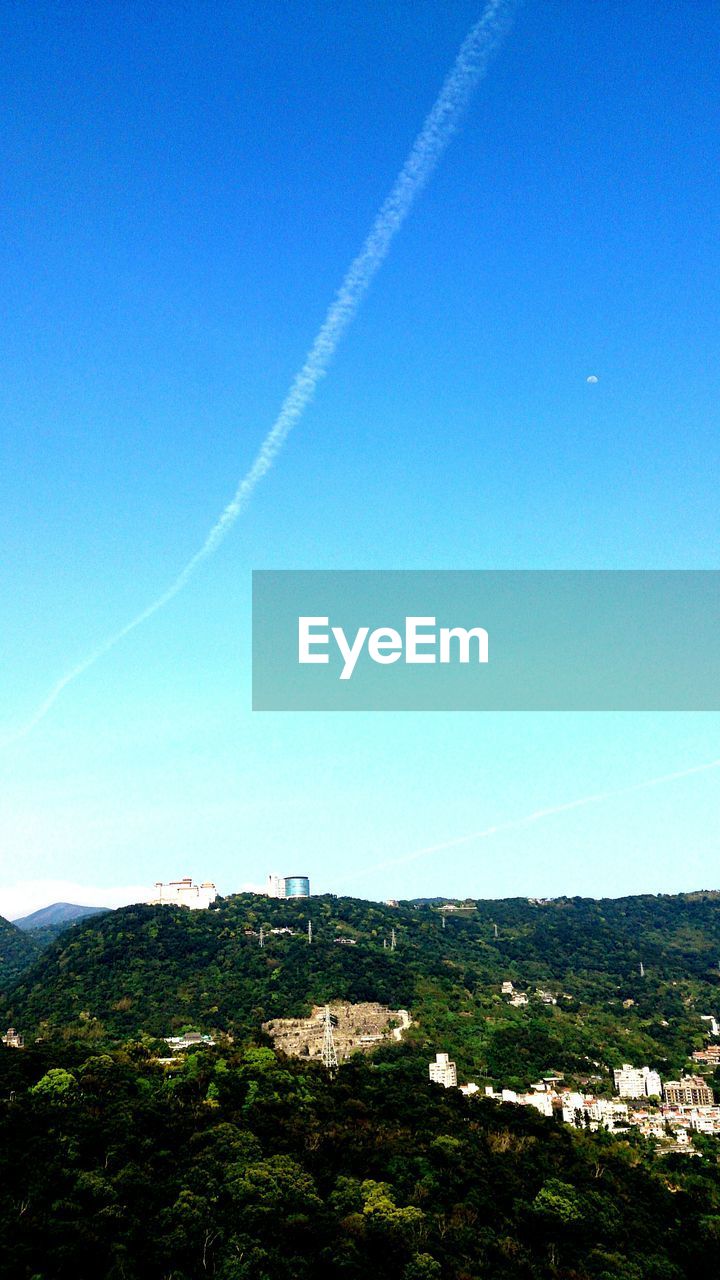 Countryside landscape against blue sky