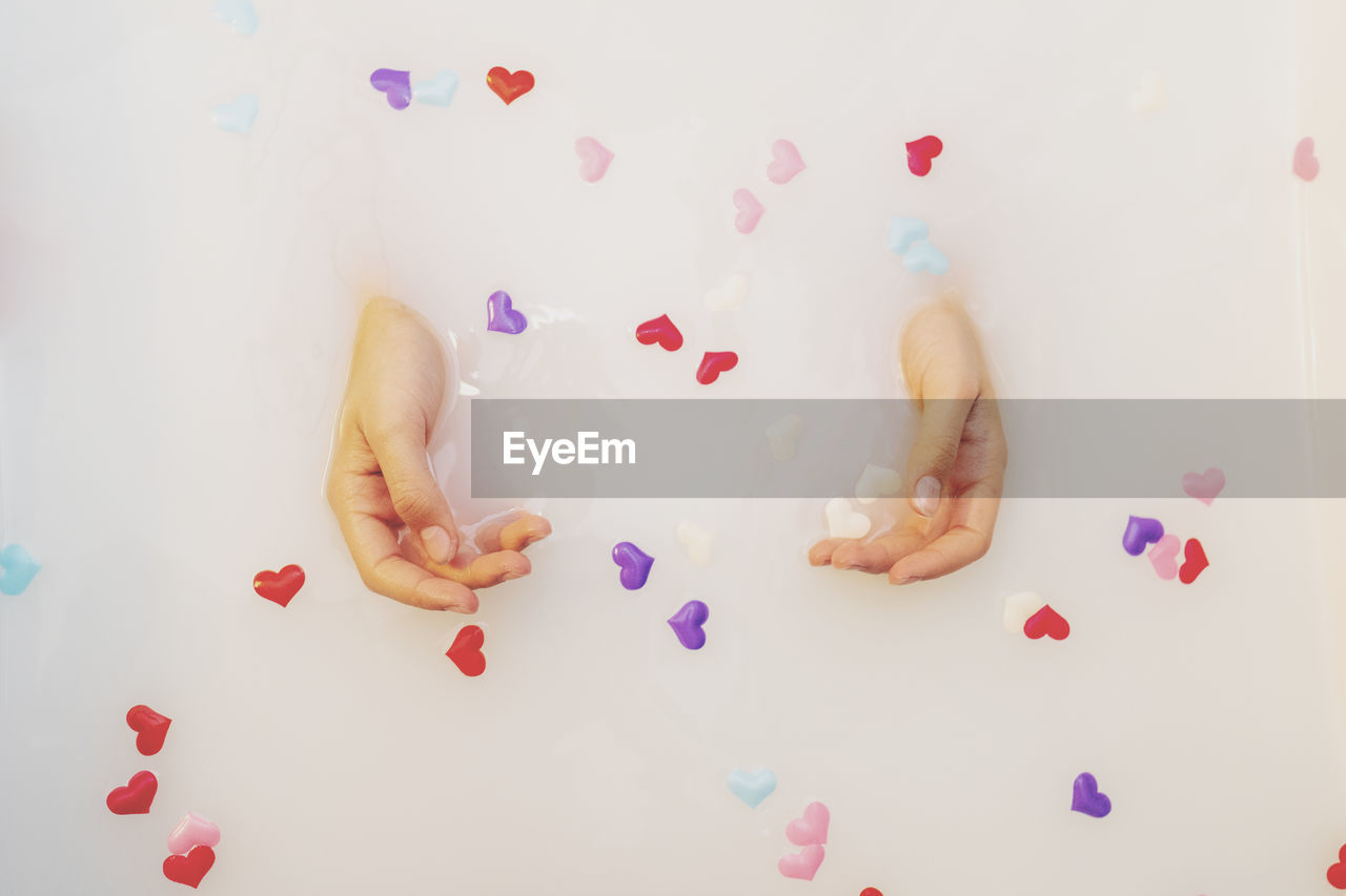 High angle view of woman hands in bathtub