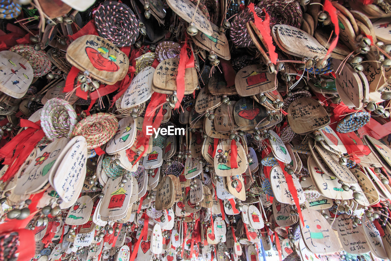 Low angle view of fortune papers hanging from roof