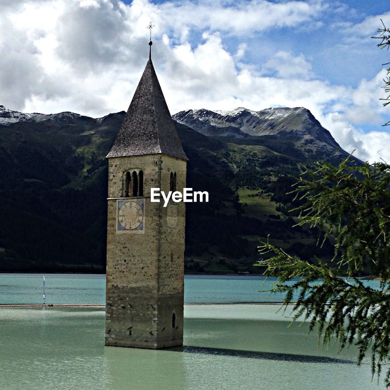 View of clock tower against mountain