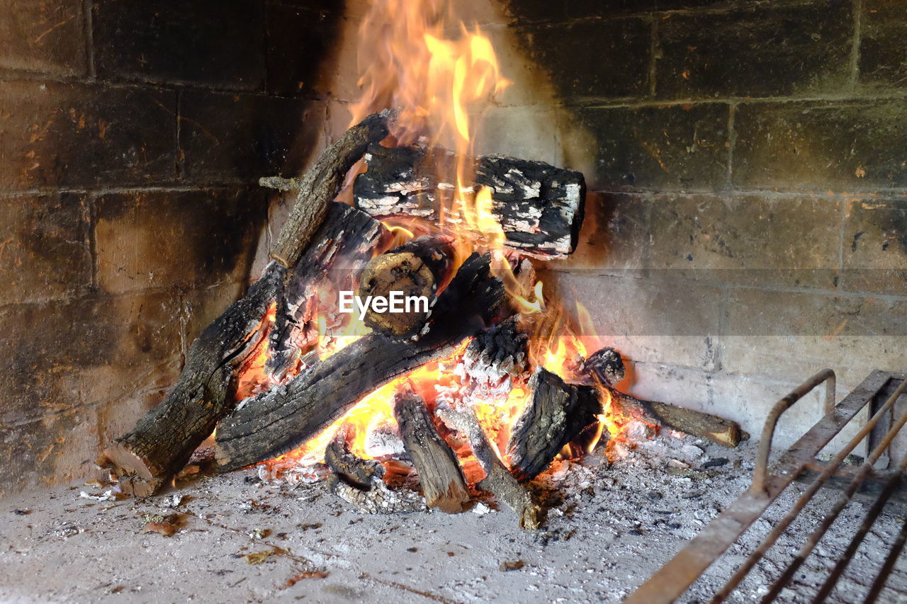 BURNING CANDLES ON BARBECUE GRILL