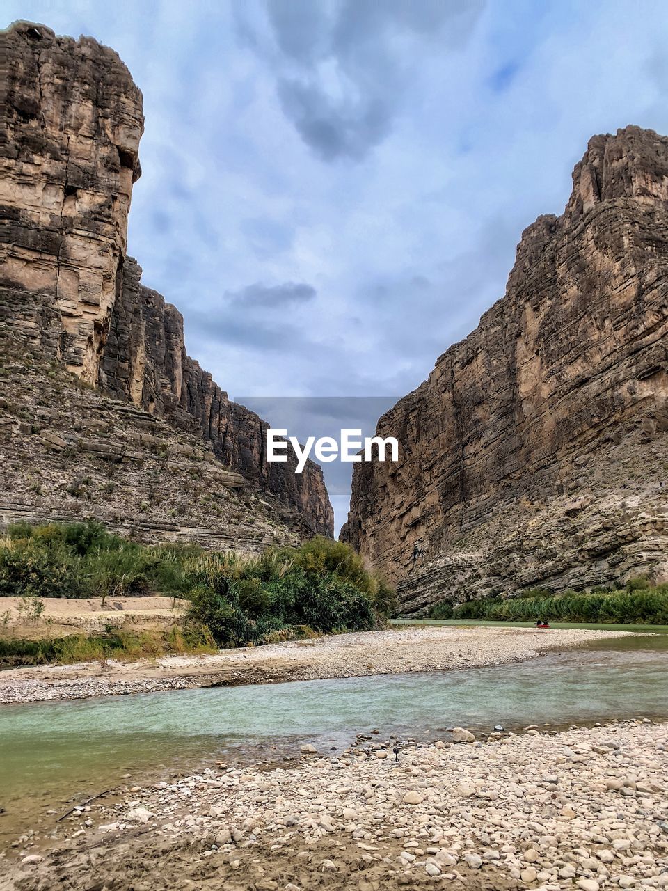 Scenic view of rocks and mountains against sky