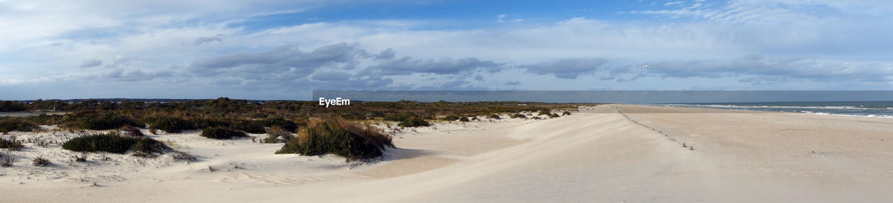 Scenic view of beach against sky