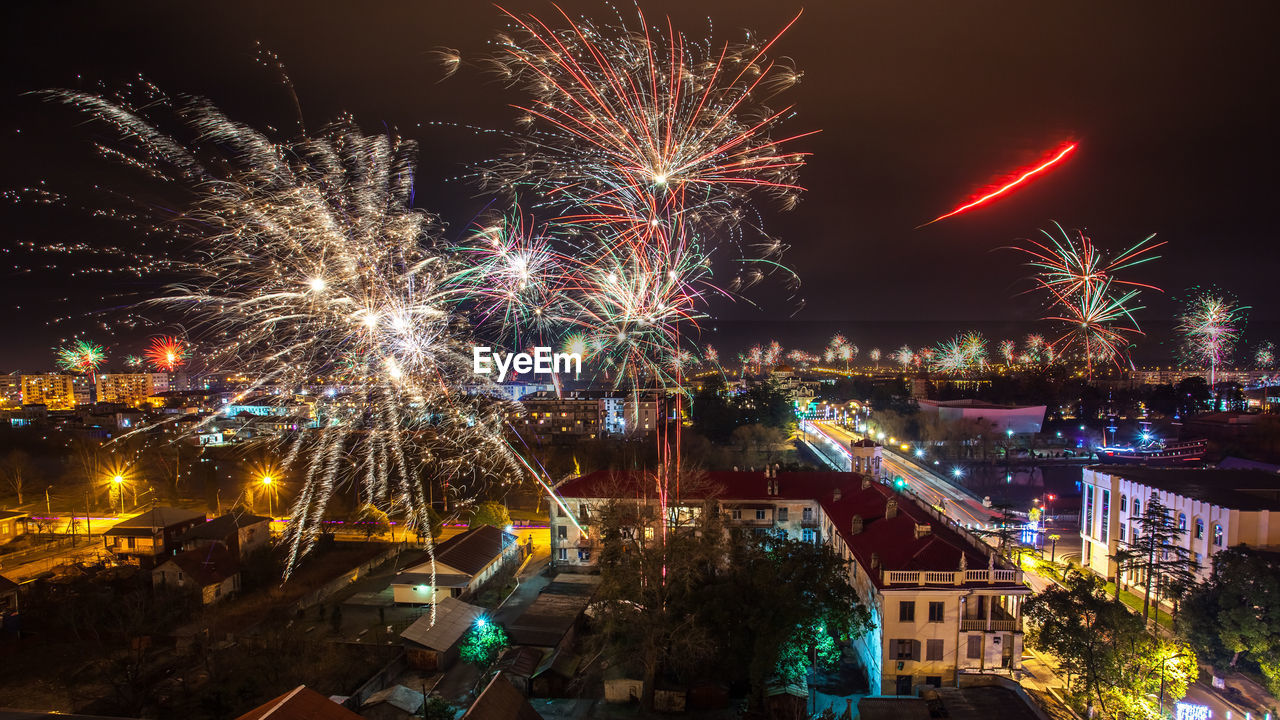 FIREWORK DISPLAY AGAINST SKY AT NIGHT