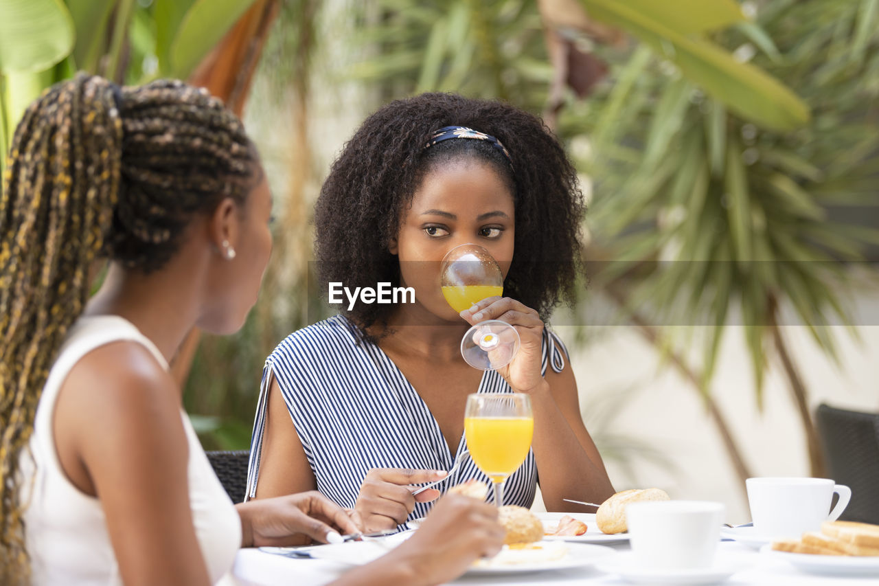 Portrait of young woman eating food