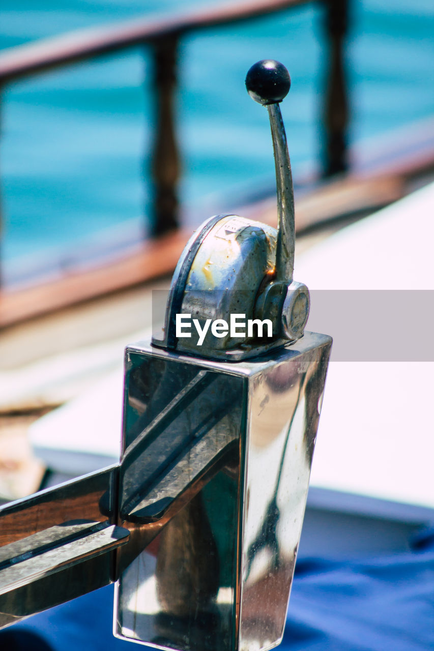 CLOSE-UP OF BOAT MOORED AT SEA