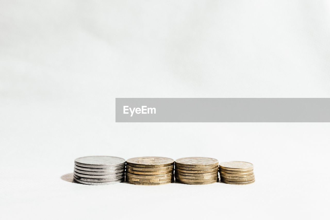 Stack of coins against white background