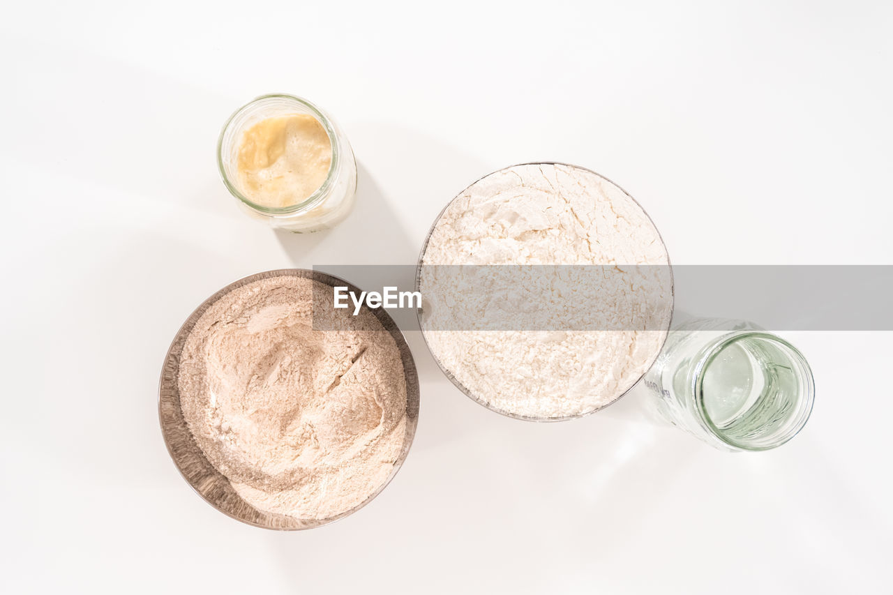 food and drink, powder, drink, refreshment, studio shot, food, white background, glass, indoors, no people, drinking glass, still life, directly above, freshness, high angle view, household equipment, coin