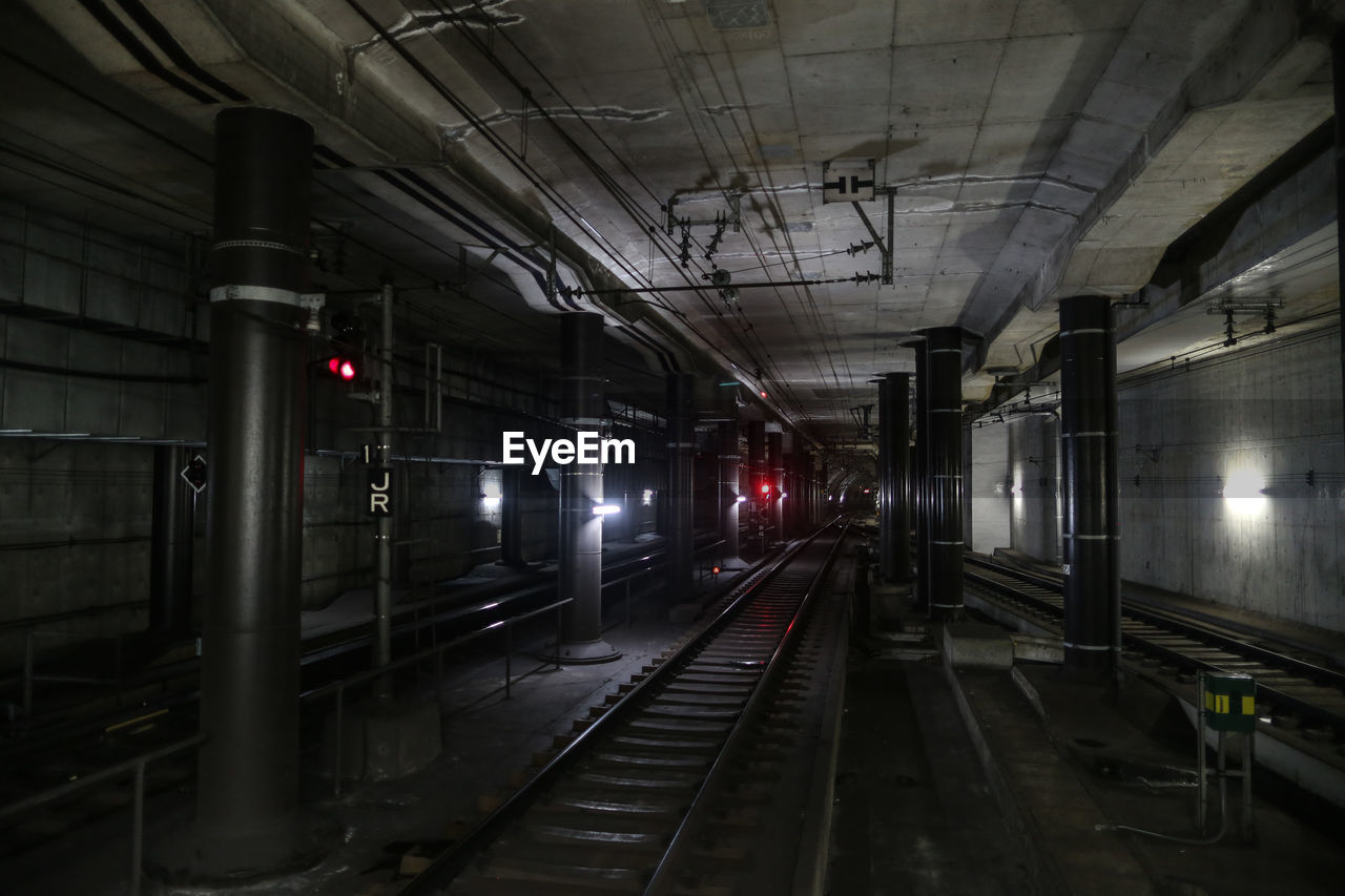 RAILROAD TRACKS AT RAILROAD STATION PLATFORM