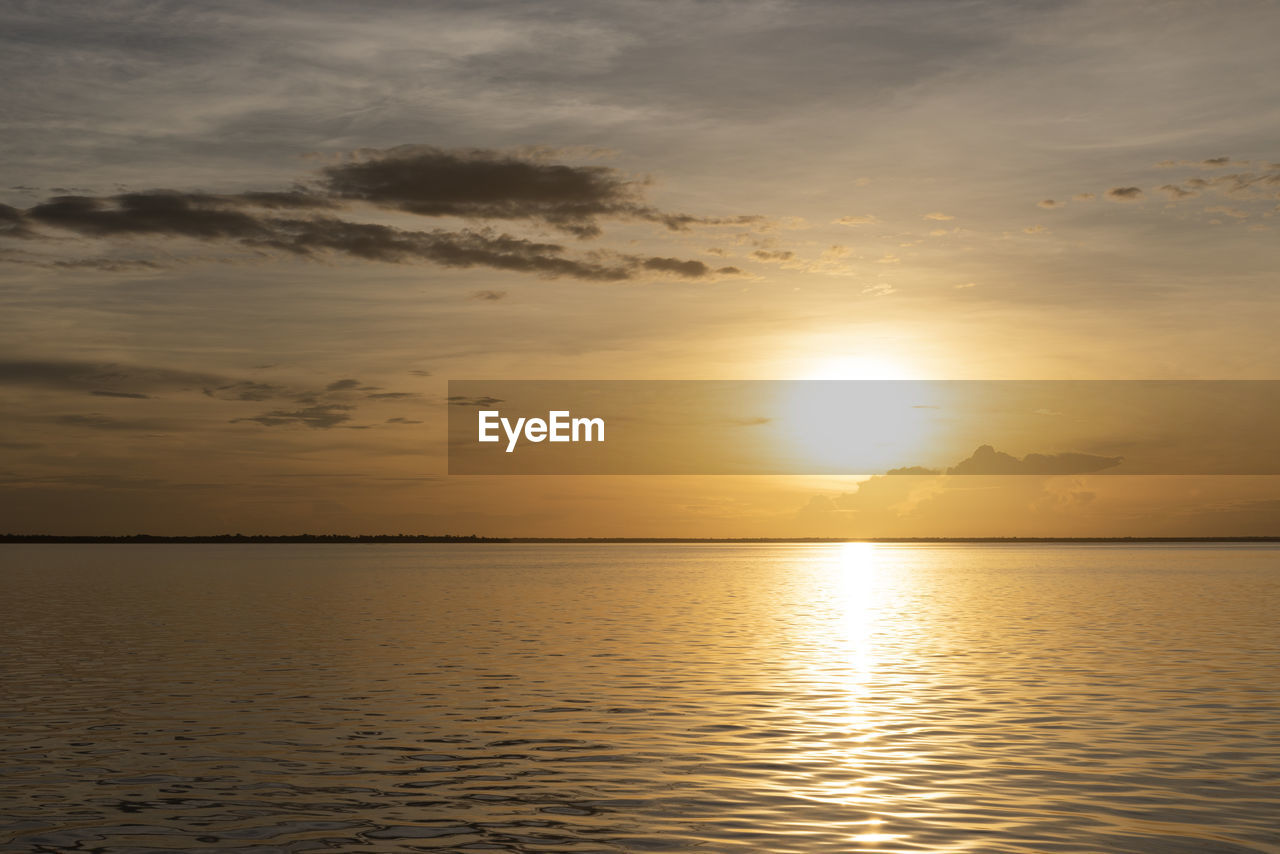 Beautiful colorful amazon sunset over the waters of negro river