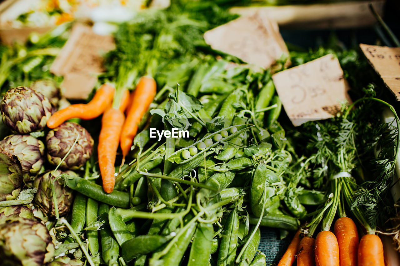 CLOSE-UP OF CHOPPED VEGETABLES IN MARKET STALL