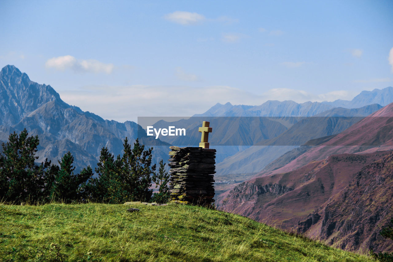 VIEW OF TEMPLE AGAINST MOUNTAIN