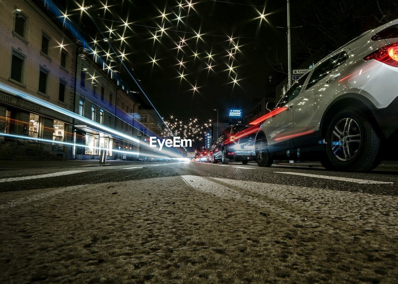 CARS ON STREET AT NIGHT