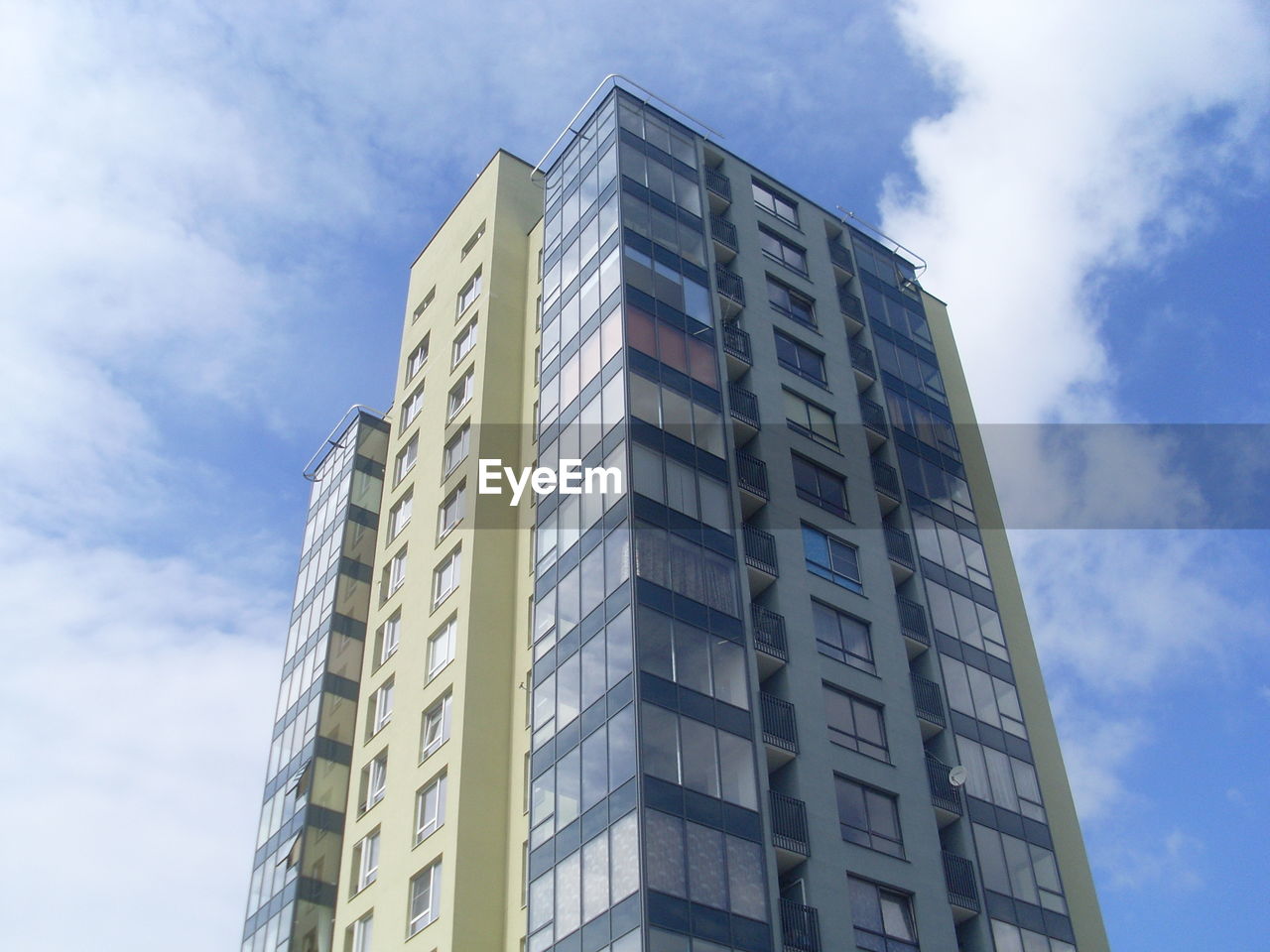 Low angle view of office building against sky