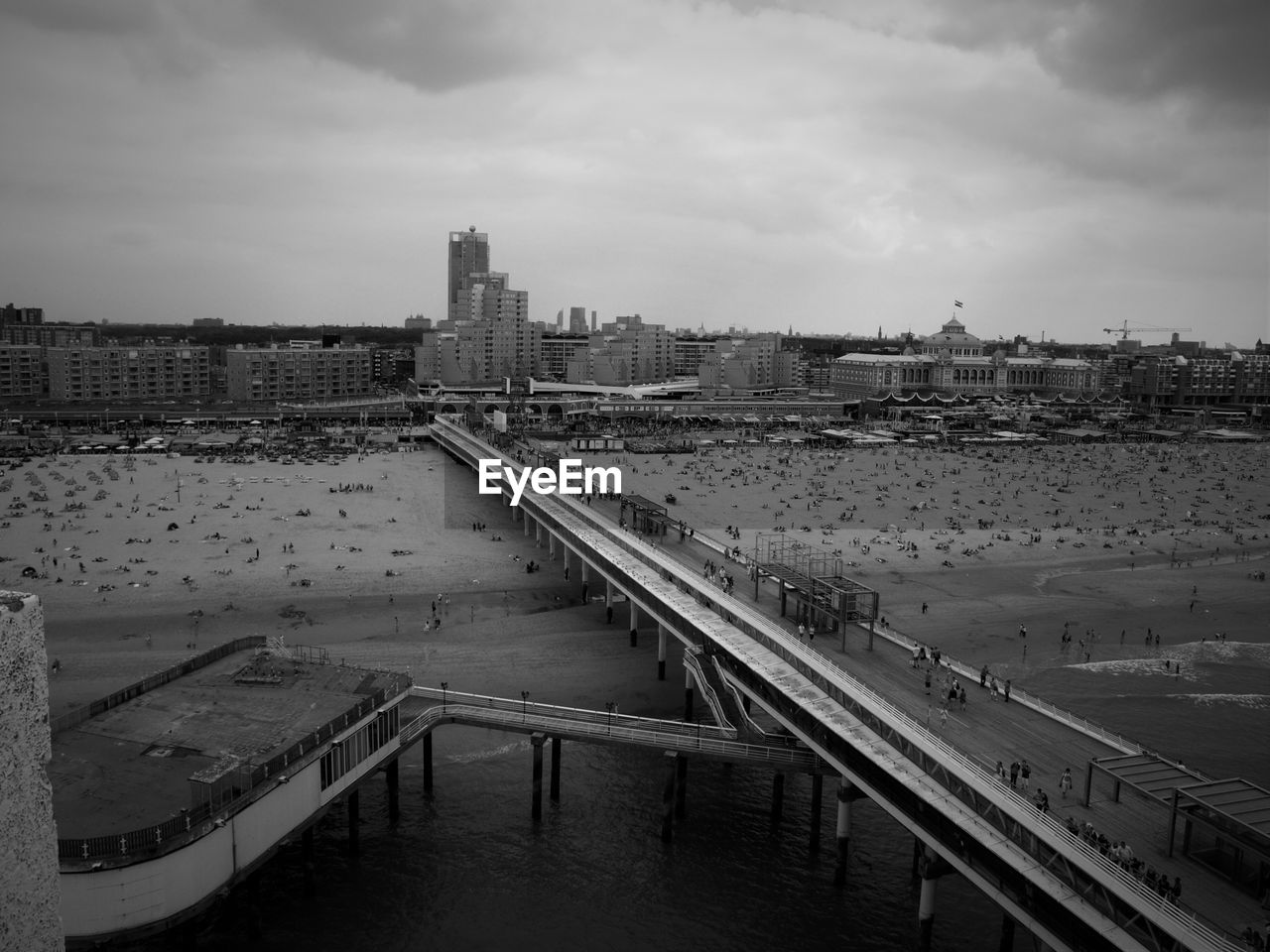 High angle view of people on pier at beach in scheveningen