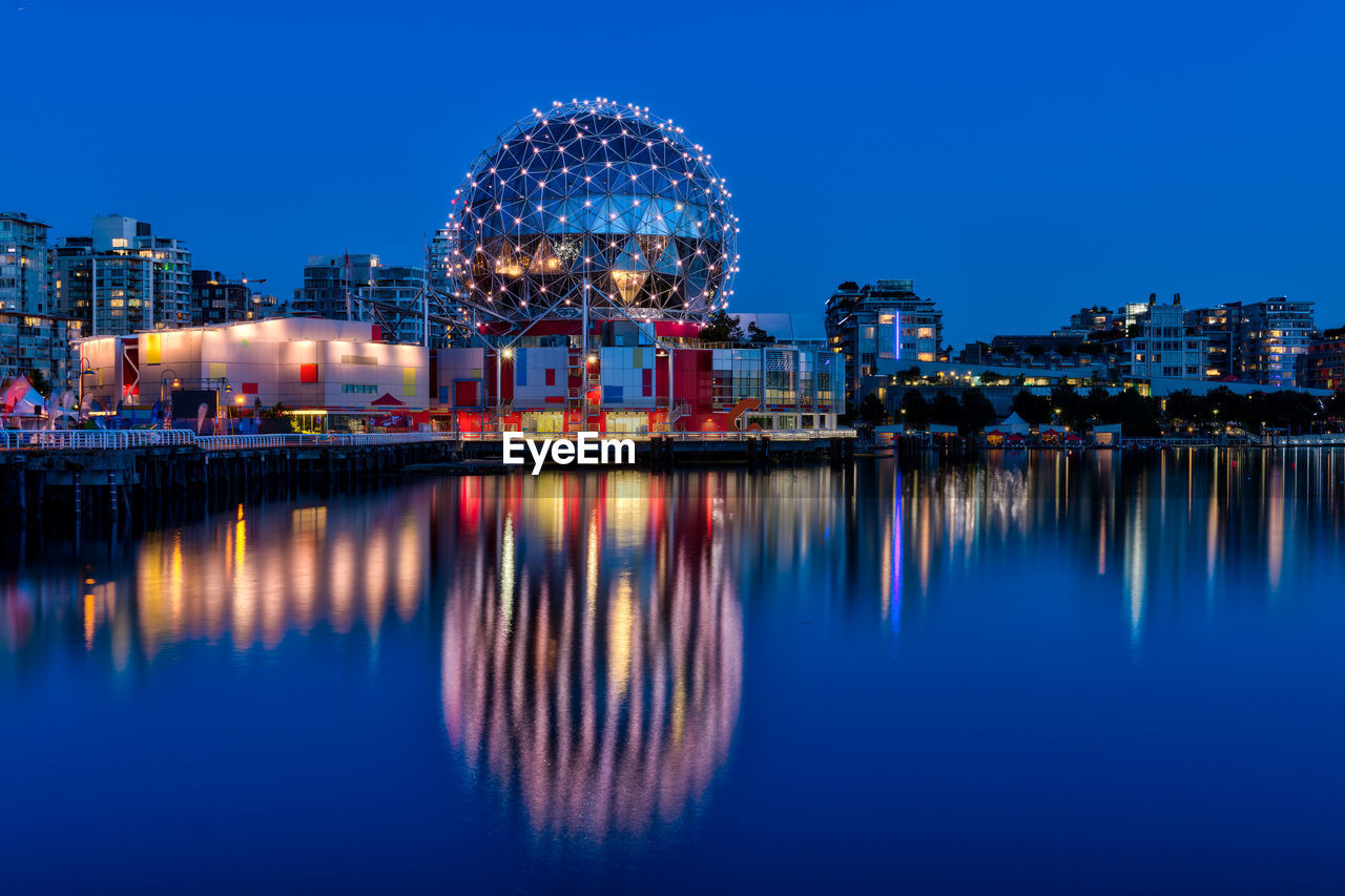 ILLUMINATED FERRIS WHEEL AT NIGHT