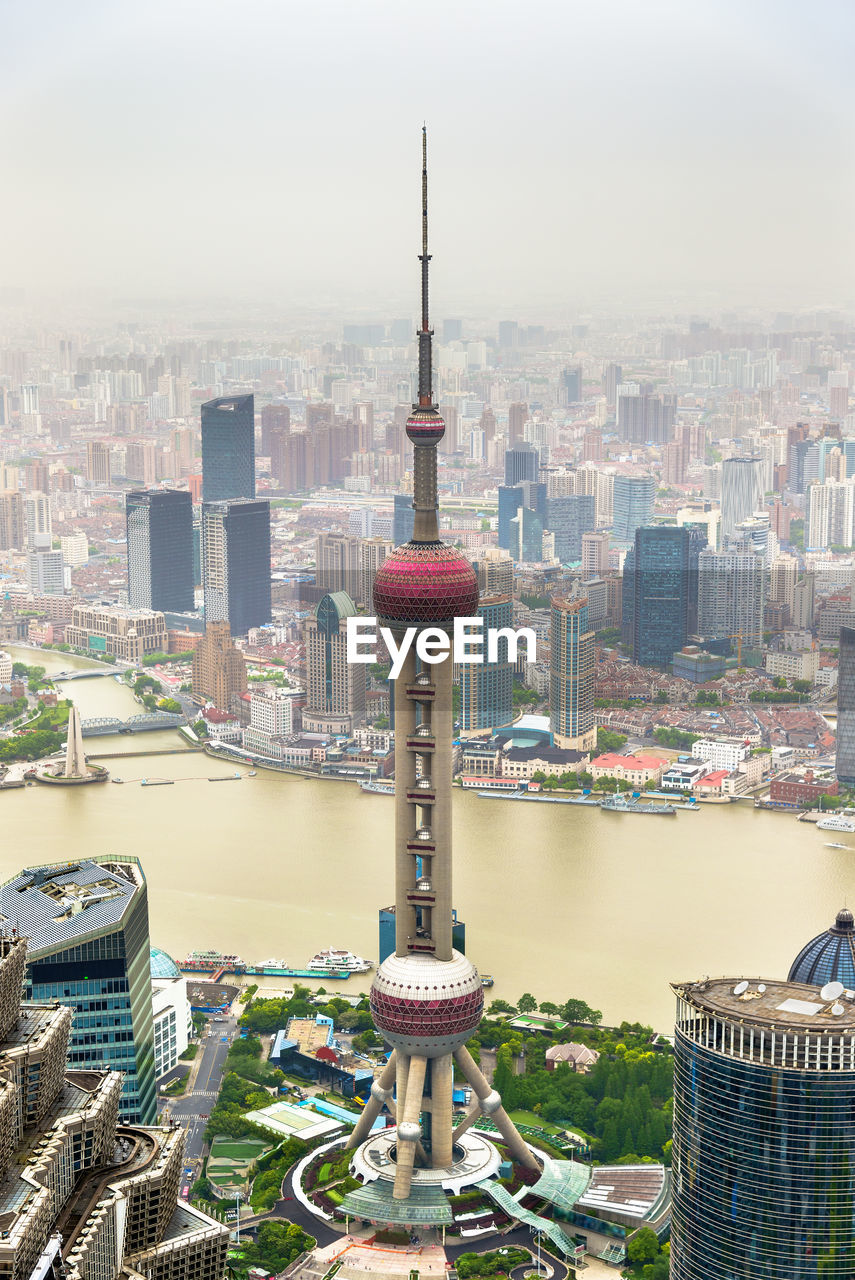 AERIAL VIEW OF BUILDINGS AGAINST SKY