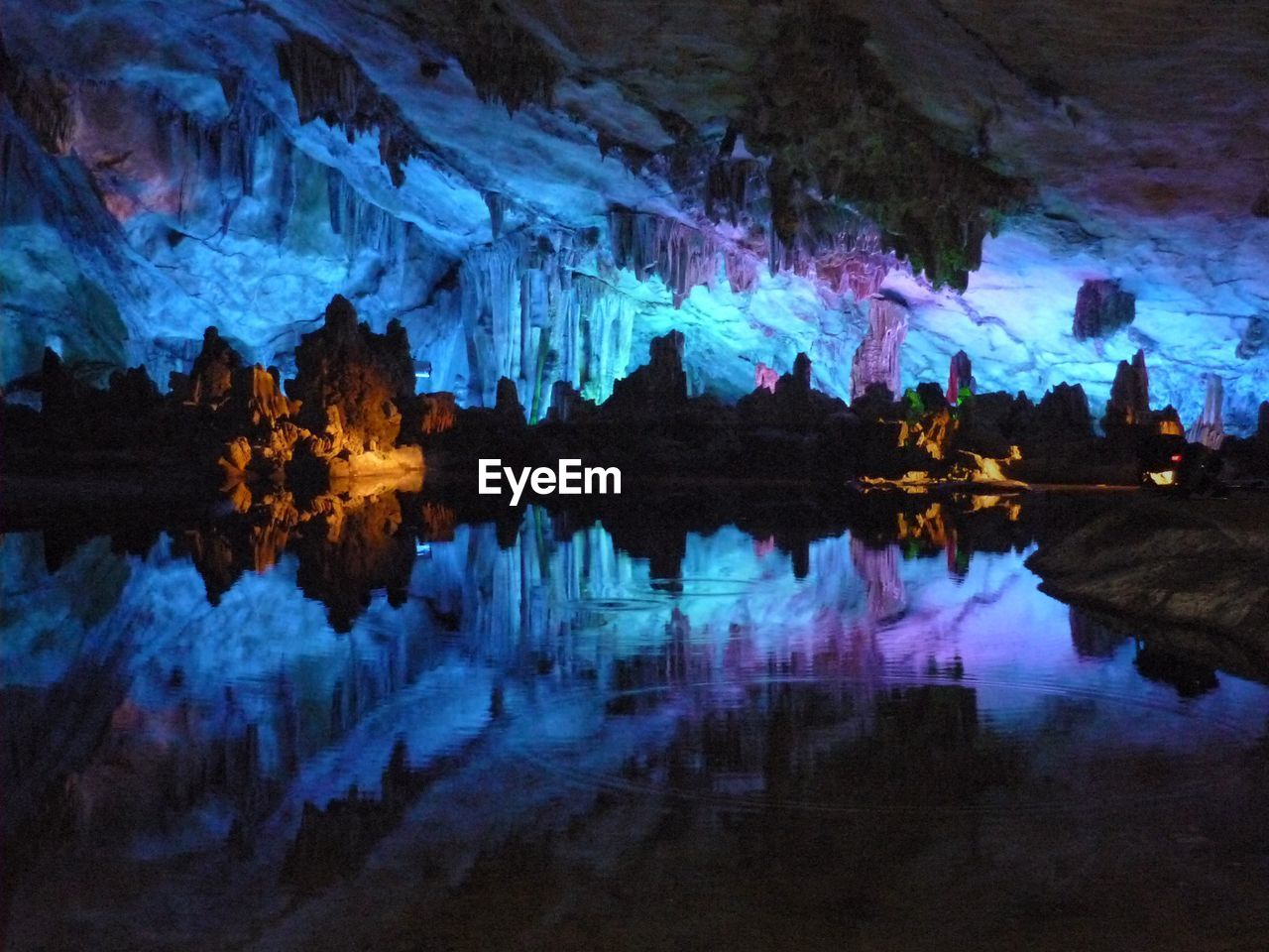 Reflection of rocks on water in cave