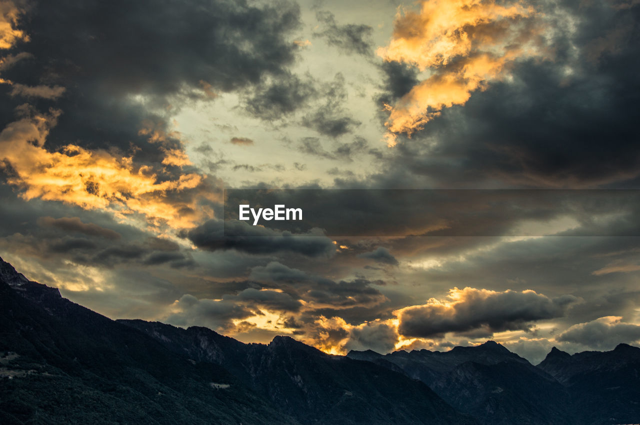 Scenic view of dramatic sky during sunset