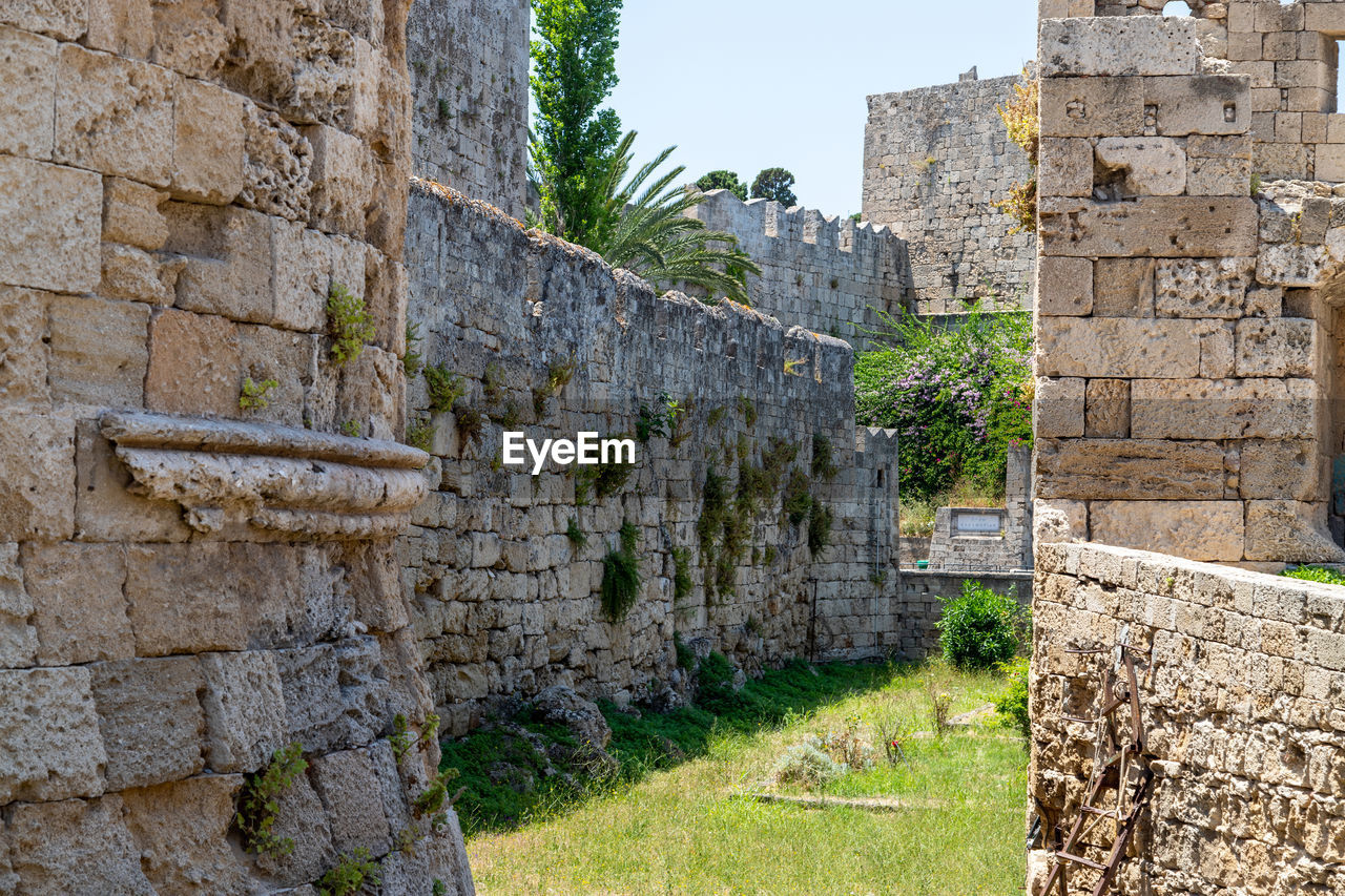 Part of the antique city wall with ditch in the old town of rhodes city on greek island rhodes