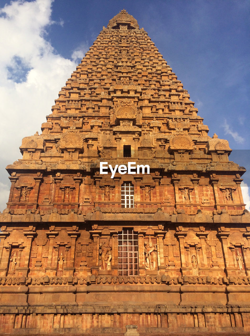 LOW ANGLE VIEW OF TEMPLE AGAINST BUILDING