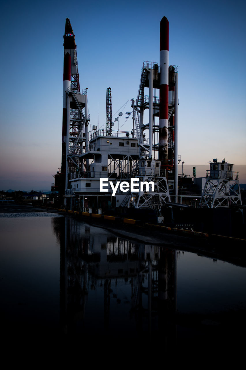 VIEW OF FACTORY BY RIVER