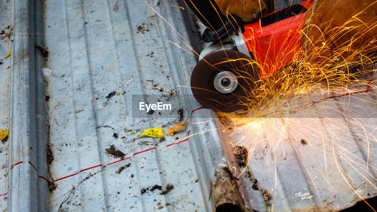 Grinder cutting metal in factory